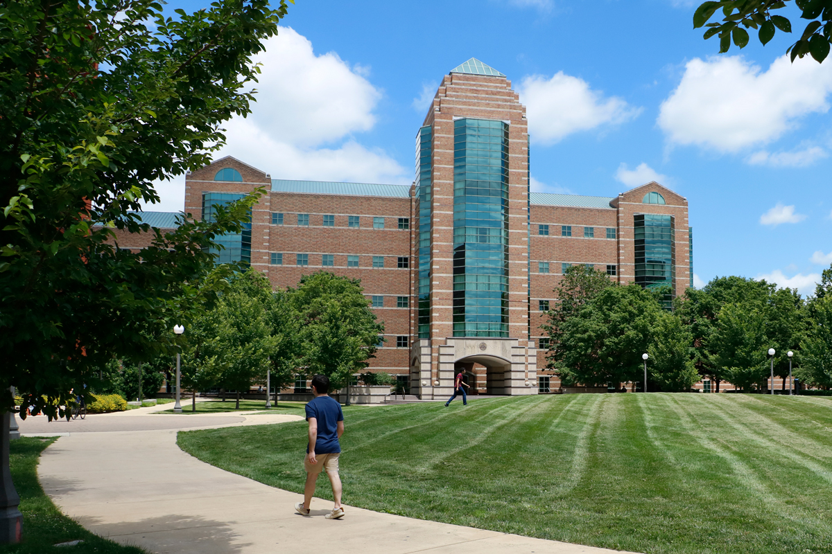 A student approaches the Beckman Institute from the north quad